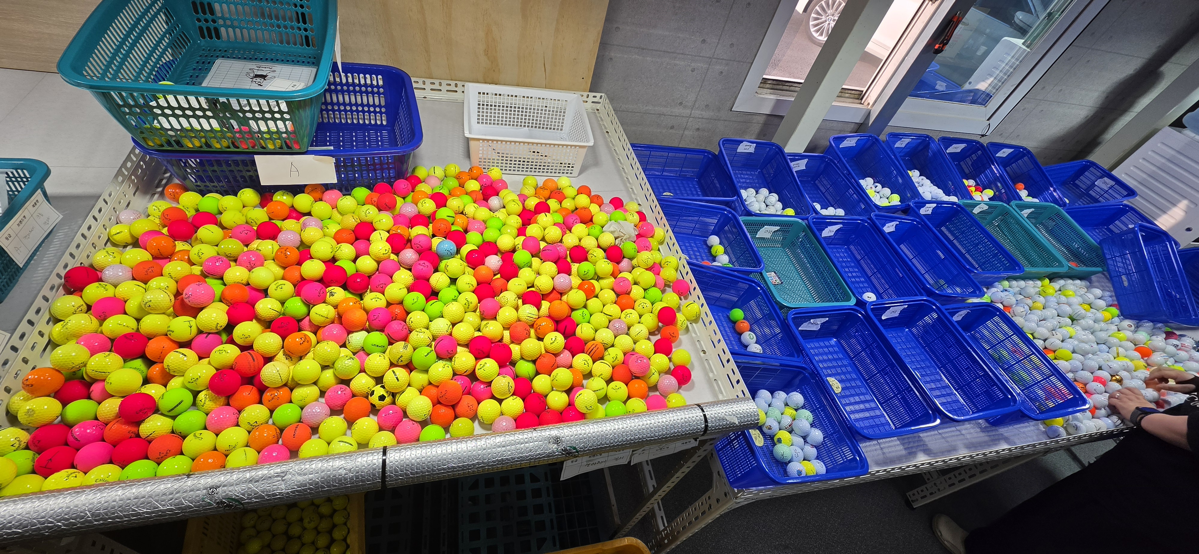 Golf ball washing and pre-sorting stage